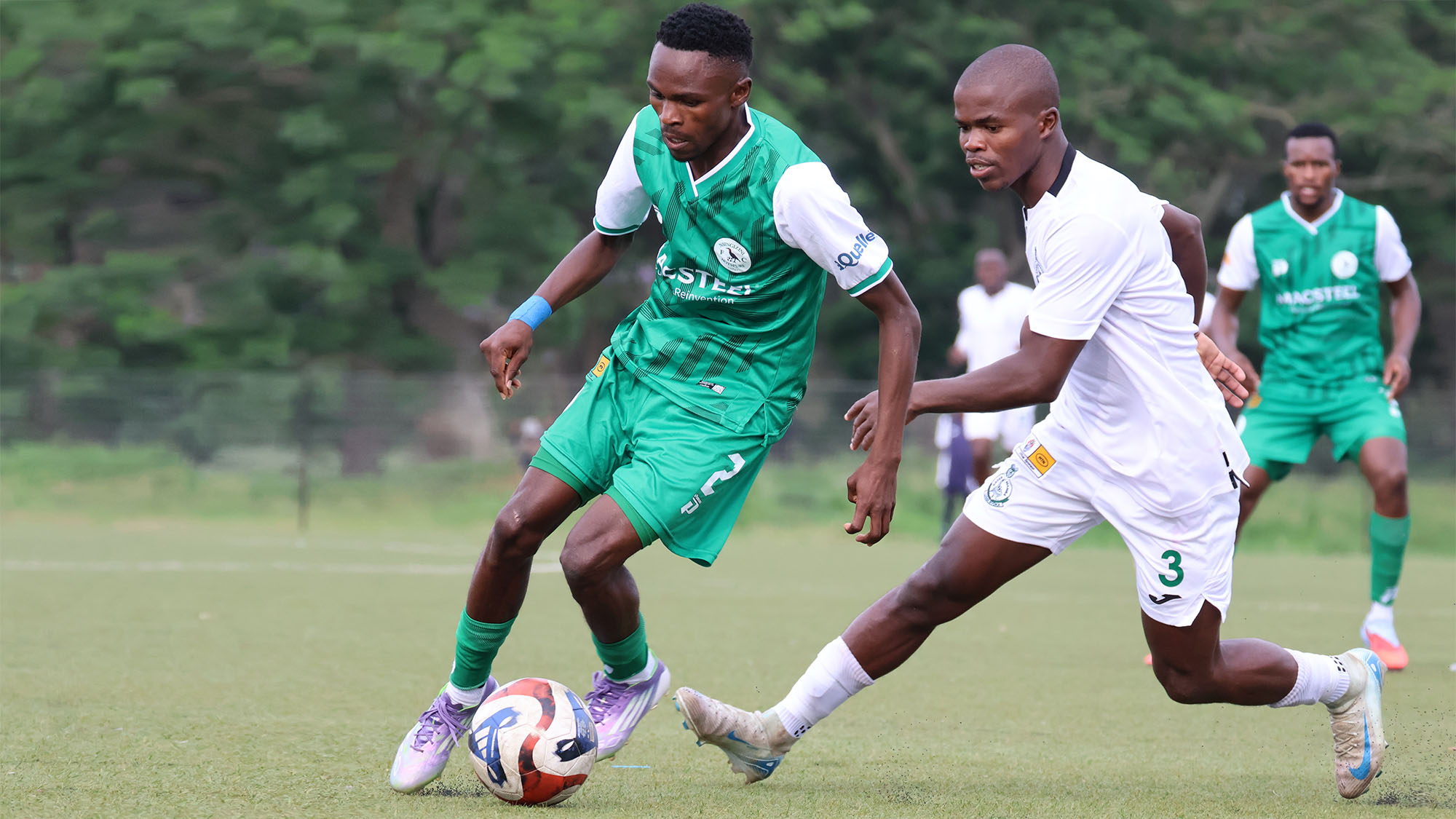 Nsingizini Hotspurs’ Wenzile Lushaba (L) attempts to evade Green Mamba’s Neliswa Nkambule during their MTN Premier League match played on Wednesday. Green Mamba won the contest 1-0. (Pic: Nimrod Hlophe)